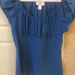 Blue cap sleeve top with empire waist.